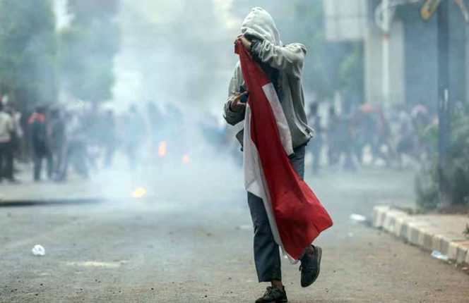 
					Lutfi Alfiandi (20), pemuda yang fotonya viral saat membawa bendera di kawasan Parlemen, Senayan, Jakarta Pusat pada September 2019 lalu.